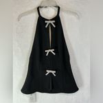 Chic Black Backless Dress with White Bow Details Photo 1