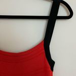 Sexy Black and Orange/Red crisscross back stretch knit dress. Photo 9