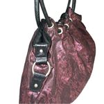 Purple and black print baggy Women's Bag. Has faux leather round strap Photo 2