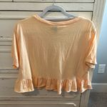 Wild Fable  orange crop t-shirt with ruffle detailing on bottom Sz M Photo 1