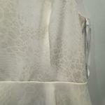 Cachet Cream Peplum Dress with Rhinestone Detail Photo 6