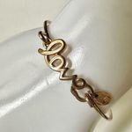 Gold tone love bangle bracelet Photo 1