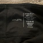 Hylete Size M  black leggings with zipper detail. Thick material. Great support. Photo 1