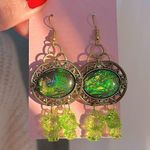 Hot Topic Dragon eye snake hello kitty Green Gold Dangle Earrings Photo 0
