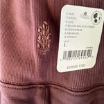 NWT FREE PEOPLE MOVEMENT STUIDO SIREN PANTS COLOR IS BLACK WALNET Size L Photo 3