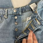 Divided Light Wash Button Fly Raw Hem Mom Jeans Photo 2