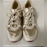 ALDO  Vany gold and white tennis shoes women’s size 7.5 in great shape Photo 1