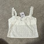 Princess Polly White cropped tank, with floral sleeves and white embroidered print. It is brand new never worn. NWT Photo 1