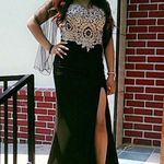 back with gold sparkly sparkles on it and open thigh dress Black Size 8 Photo 0