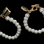 Set of 2 costume faux Gold and White Pearl Bracelets. Photo 0