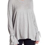 Iris Gray Bow sleeve Sweater. Size Medium Photo 1