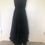 Hemline Black strapless dress with draped . Photo 2