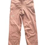 Under Armour -BLUSH COLOR LEGGINGS-SIZE XS Blush pink athletic leggings, has back pocket, drawstring waist, excellent condition Measurements: Waist: side to side 12-14 inches Inseam: 17 inches Photo 0
