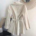 Vintage Cream beige belted long sleeves mini/midi trench coat peacoat overcoat collared neckline, double breasted button closure. Tan Photo 1