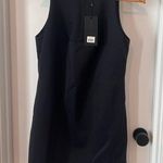 Kendall + Kylie NWT  Black Sleeveless Top with laser cutout at hem. Photo 0