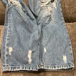 Really ripped jeans! Lol. Both legs ripped up but stylish. Blue Size 2 Photo 6