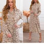 Size medium women’s long sleeve brown floral dress Photo 1