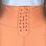 We Wore What  Solid Lace Up Biker in Peach Cobbler Photo 1