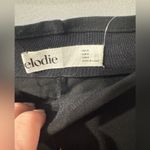 Elodie  Women's NWT Black Ribbed Flare Pants with ankle slit Sz medium Photo 5