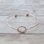 Very Light Shade of Rose Gold Tone Knot Bracelet Photo 1