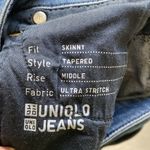 Uniqlo  jeans size 27 skinny tapered mid rise ultra stretch Photo 6
