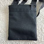 Dakine  Canvas Crossbody Bag Black Slim Profile Photo 1