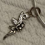 ALEX AND ANI Bracelet - Starbucks - Tinkerbell - bangle, adjustable, charms, silver tone. 2nd Starbucks on the right (Peter Pan movie reference) gently used - no flaws. Smoke free home. Photo 3