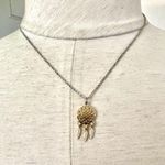 Dainty gold and silver tone dream catcher necklace Photo 1