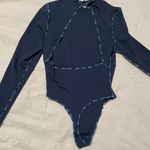 Out From Under Bodysuit Photo 1