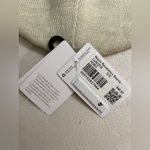 Lululemon  NWT Warm Revelation Beanie Merino Wool Blend Heathered Bone Color Photo 6