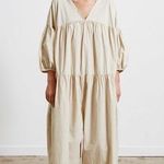 Black crane oversized puff jumpsuit in light clay color Photo 0