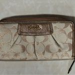 Coach  signature Charlie C zip around wallet gold with purple interior Photo 7