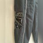 Nike  Sportwear Icon Clash Pants in Black Zippered Leg Pocket Detail Size M Photo 11