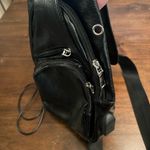 Black pleather side sling bag with USB connector Photo 1