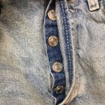 We The Free  Women’s Distressed Raw Hem Light Wash Button-Up Denim Shorts Photo 4