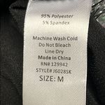 Btween Us Black Fit and Flare Ugly Christmas Skirt w/ Bows & Tinsel Garland Photo 12