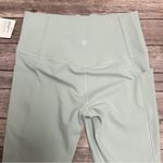 Athleta Dawn Blue Green 7/8 Salutation Stash Mesh Tight Leggings Small NWT Photo 4