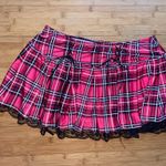 Spense Hot pink /black plaid pleated mini skirt with lace trim and bow detail Photo 1