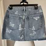 PacSun  new with tags butterfly denim jean skirt in a size 26 Photo 1