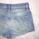We The Free  Women’s Distressed Raw Hem Light Wash Button-Up Denim Shorts Photo 7