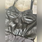 Leather PU bodysuit, spandex in the bottom.
Size M Black Size M Photo 2