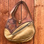 Brown and Tan Hobo Bag with Crescent Shape Photo 0