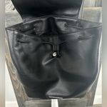 Victoria's Secret Victoria’s Secret Black Faux Leather Drawstring Backpack with Flap Closure Photo 1