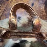 Skechers | small, camouflage faux fur backpack Photo 2