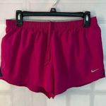 Nike dri-fit magenta lined running shorts size medium Photo 0