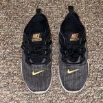 Nike Womens Flex TR9 Black with Gold Athletic Sneakers Shoes Photo 1