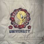 Looney Tunes Vintage tan embroidered Tweety 26/28W bib overalls Photo 1