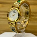 Rhinestone Watch by Faberge Gold Tone Stainless with Green and White Gemstones Size 6 Photo 1