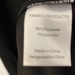 Women’s Sleeveless Black Vneck ruched dress with front slit size Large Photo 4