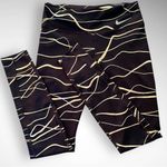 Nike  Women's‎ Icon Clash Fast Dri-Fit Black and Gold Leggings Size Small | EUC Photo 4